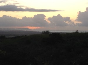 7:11 a.m. the sun peaks out 20 mies down the coast near Diamondhead