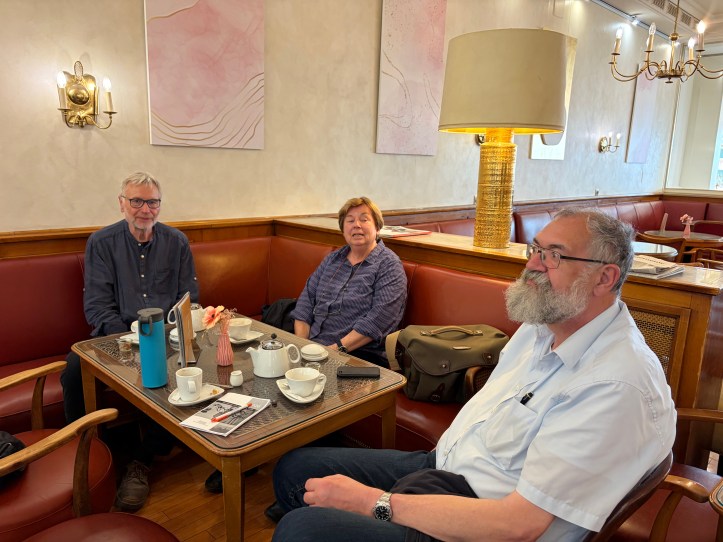 Greeter Rainor with friends stopping for a coffee during our walk.
